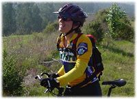 a Volunteer Bicycle Patrol member on a trail ride